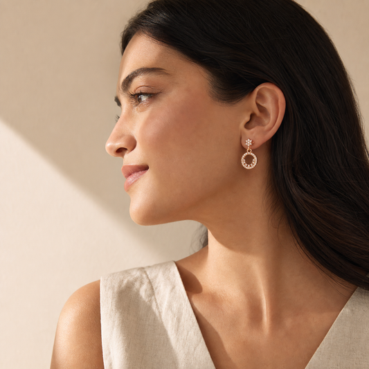 Classic Stud Earrings worn in a side-profile lifestyle shot