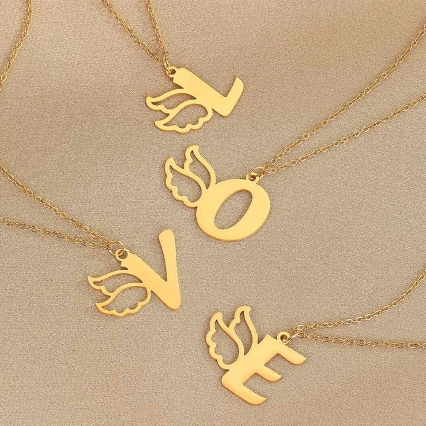 "Soaring Initial - Custom Winged Alphabet Necklace" "Wings of Identity - Personalized Single Letter Necklace" "